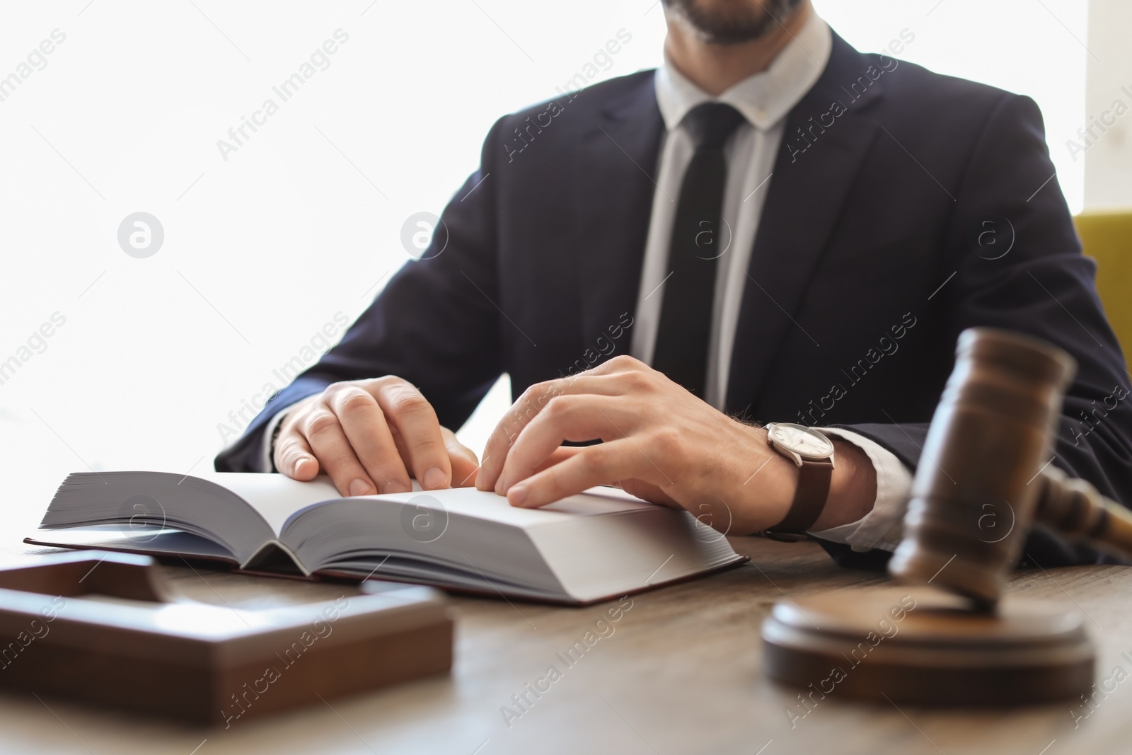 Photo of Male lawyer working in office