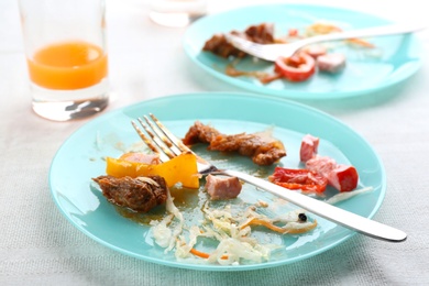 Photo of Food leftovers after party on table, closeup