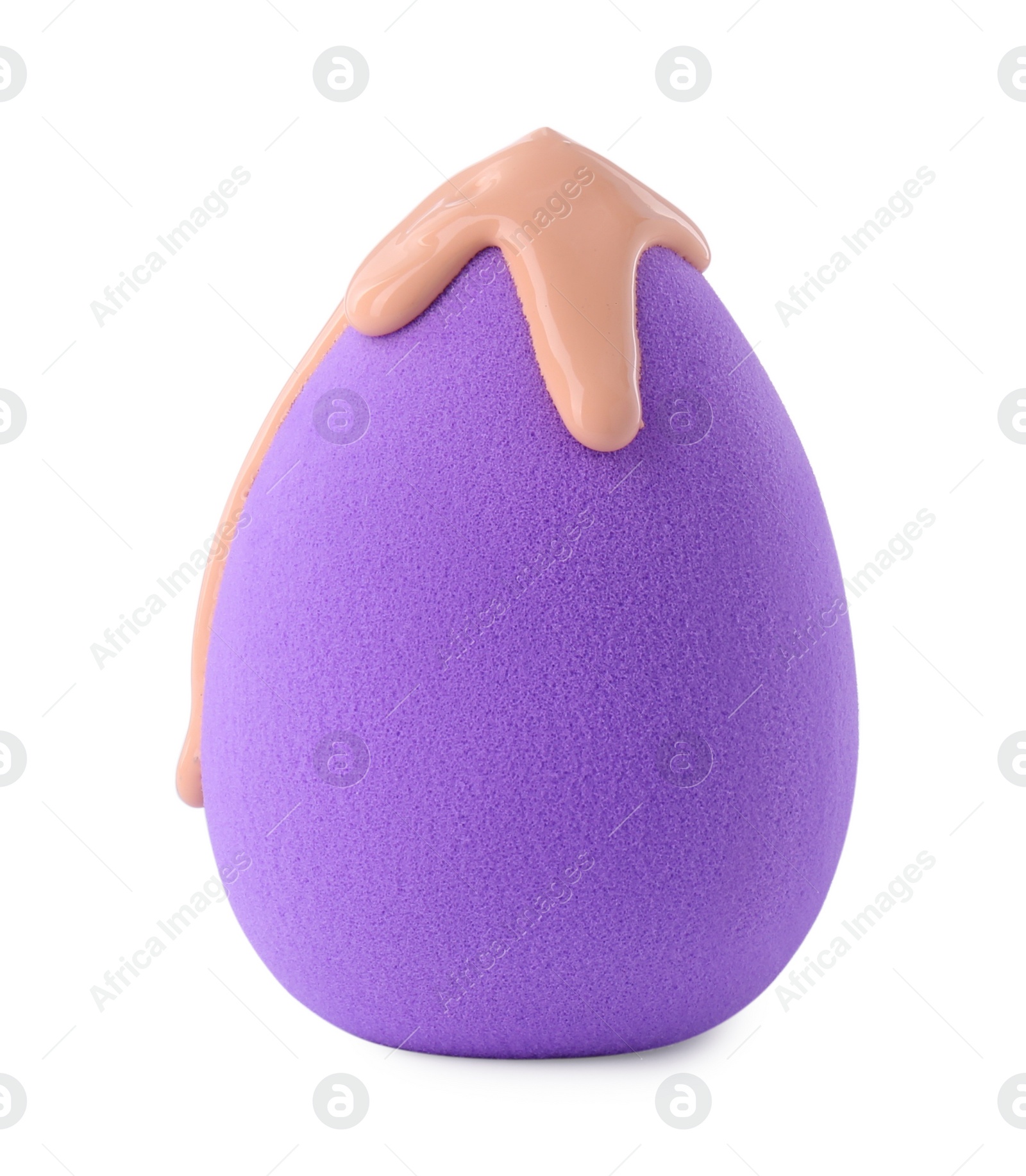 Photo of Purple makeup sponge with skin foundation isolated on white