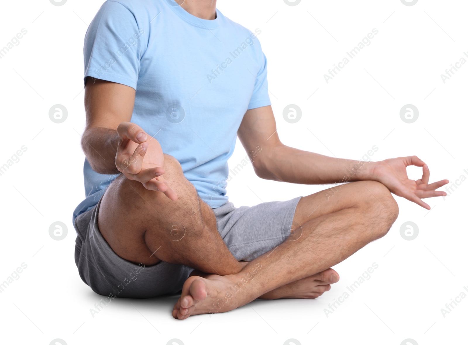 Photo of Man meditating on white background, closeup. Harmony and zen