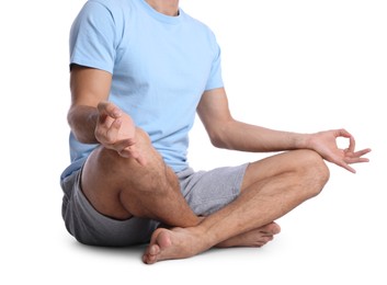 Photo of Man meditating on white background, closeup. Harmony and zen