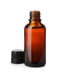 Photo of Bottle of essential oil isolated on white