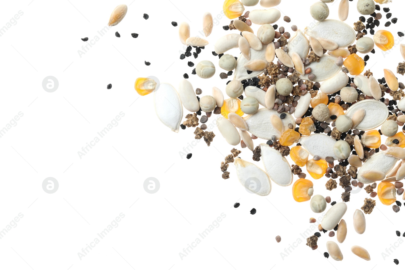 Photo of Mix of vegetable seeds on white background, top view