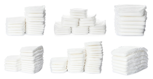 Image of Set of baby diapers on white background