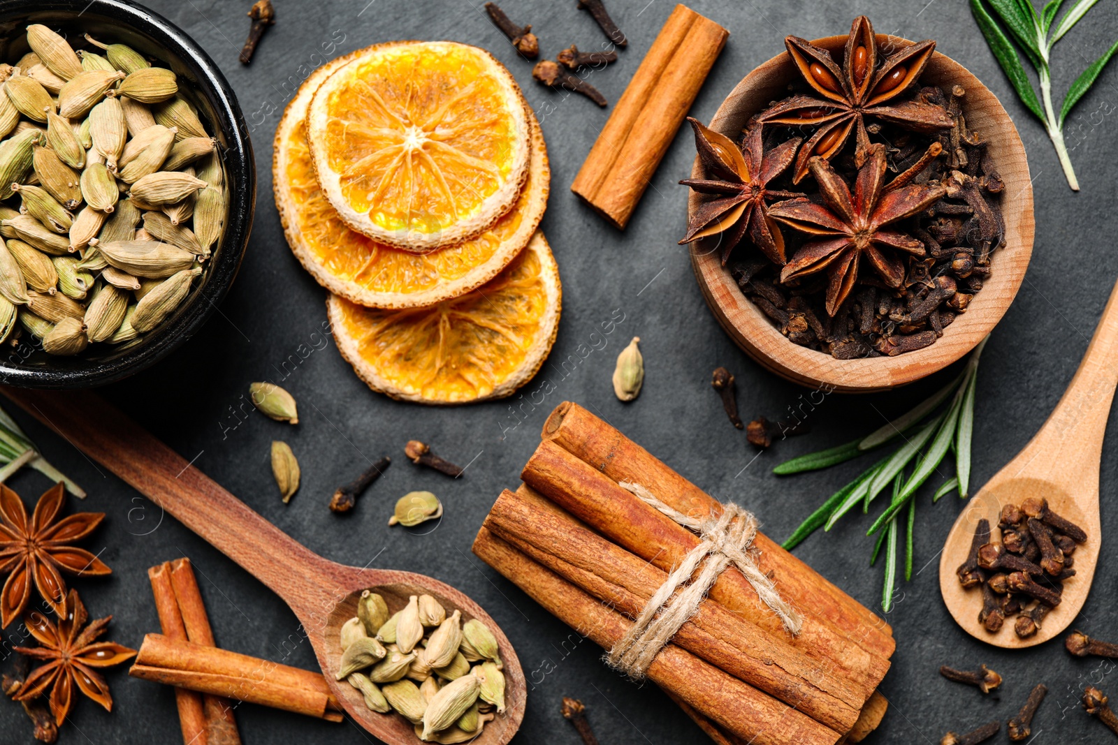 Photo of Flat lay composition with mulled wine ingredients on black table