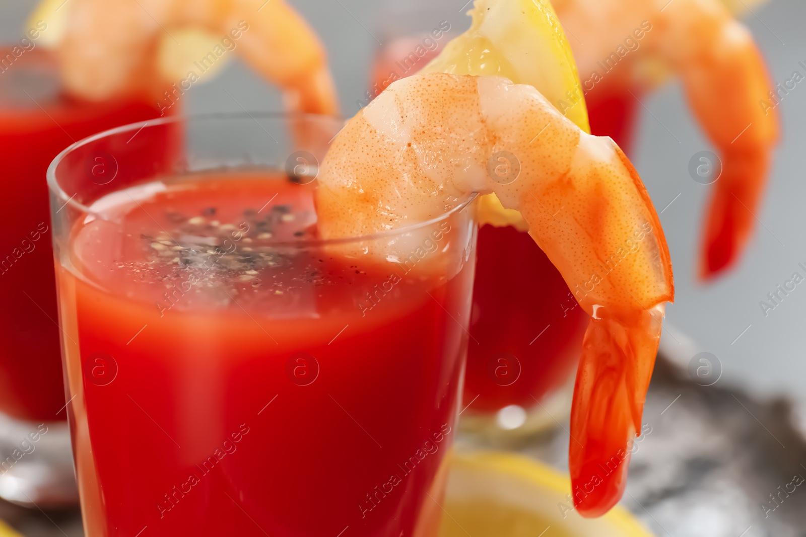 Photo of Delicious shrimp cocktail with tomato sauce, closeup