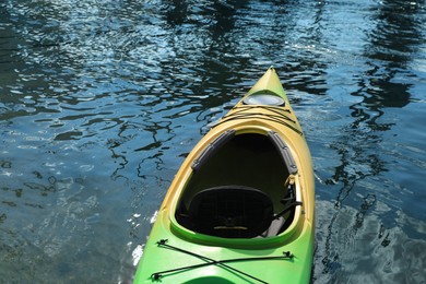 Photo of Modern kayak on river, closeup. Summer camp activity