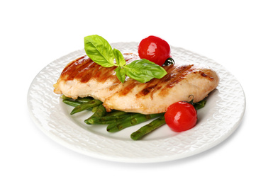 Photo of Tasty grilled chicken fillet with green basil, beans and tomatoes isolated on white