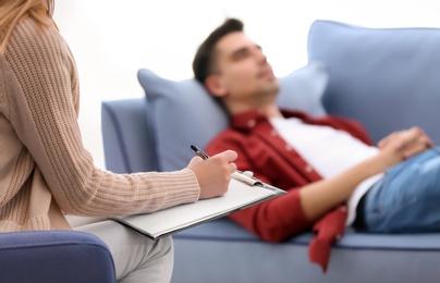 Female psychologist with client in office