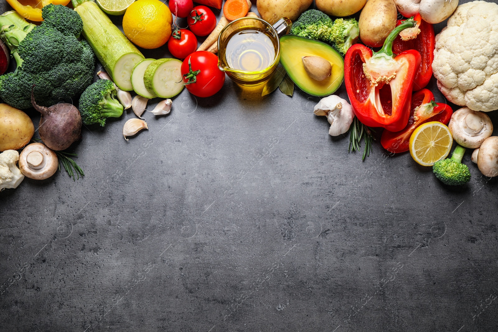 Photo of Flat lay composition with fresh products on grey table, space for text. Healthy cooking