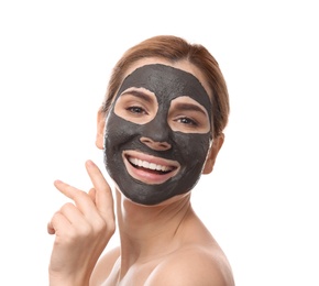 Beautiful woman with black mask on face against white background