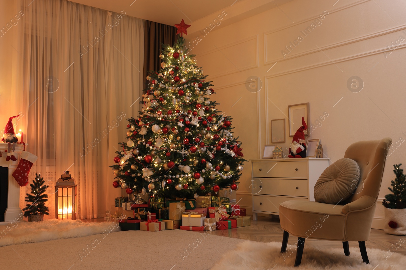 Photo of Festive living room interior with Christmas tree and comfortable armchair