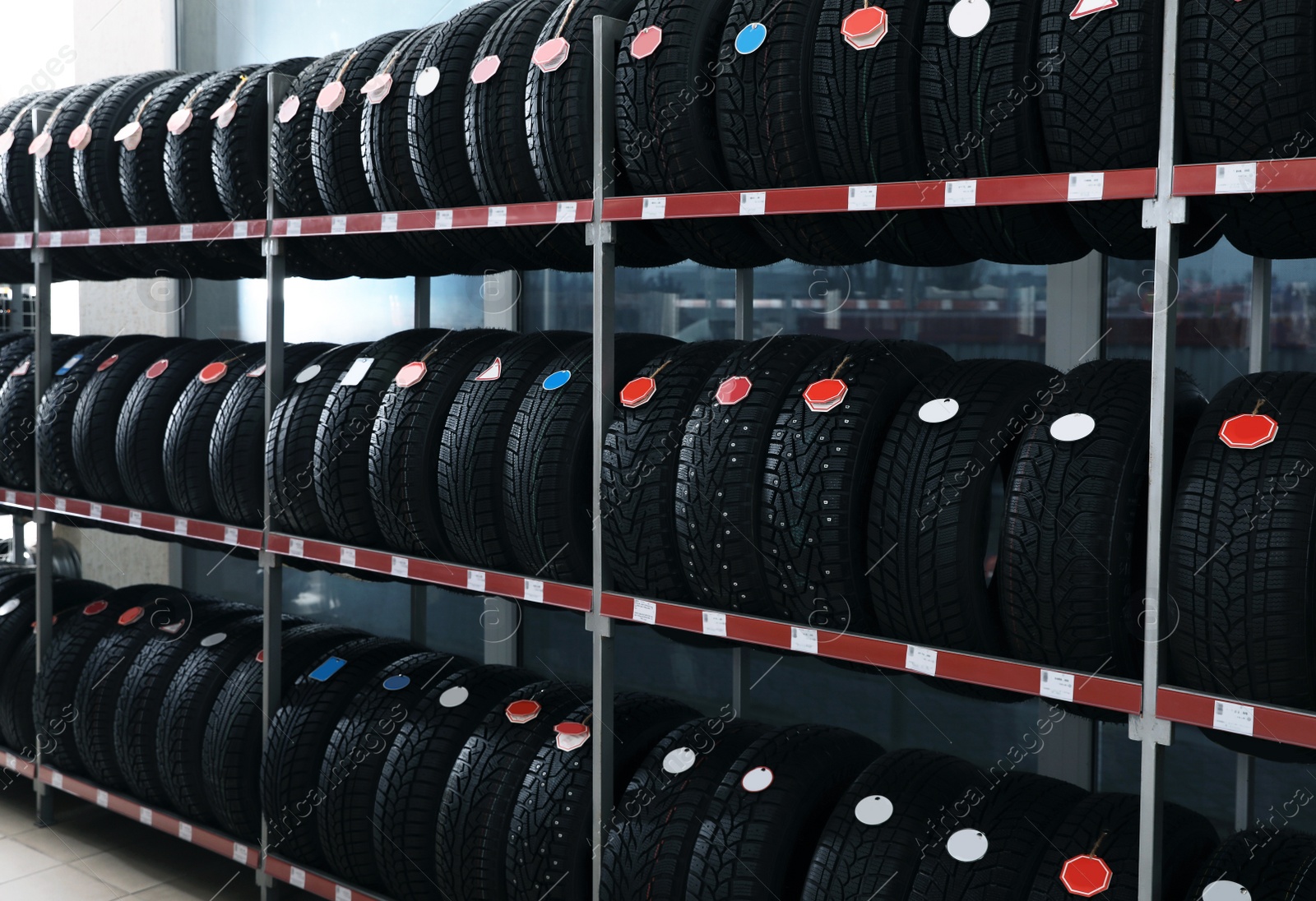 Photo of Car tires on rack in auto store