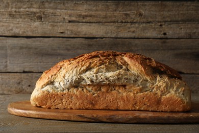 Photo of Freshly baked sourdough bread on wooden table