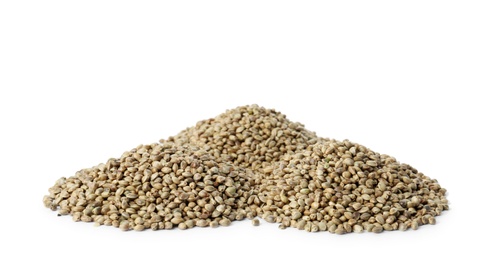 Photo of Piles of hemp seeds on white background