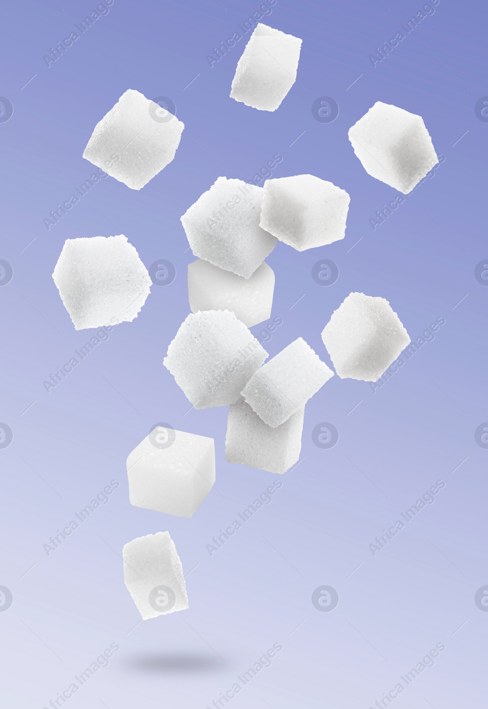 Image of Refined sugar cubes in air on color gradient background