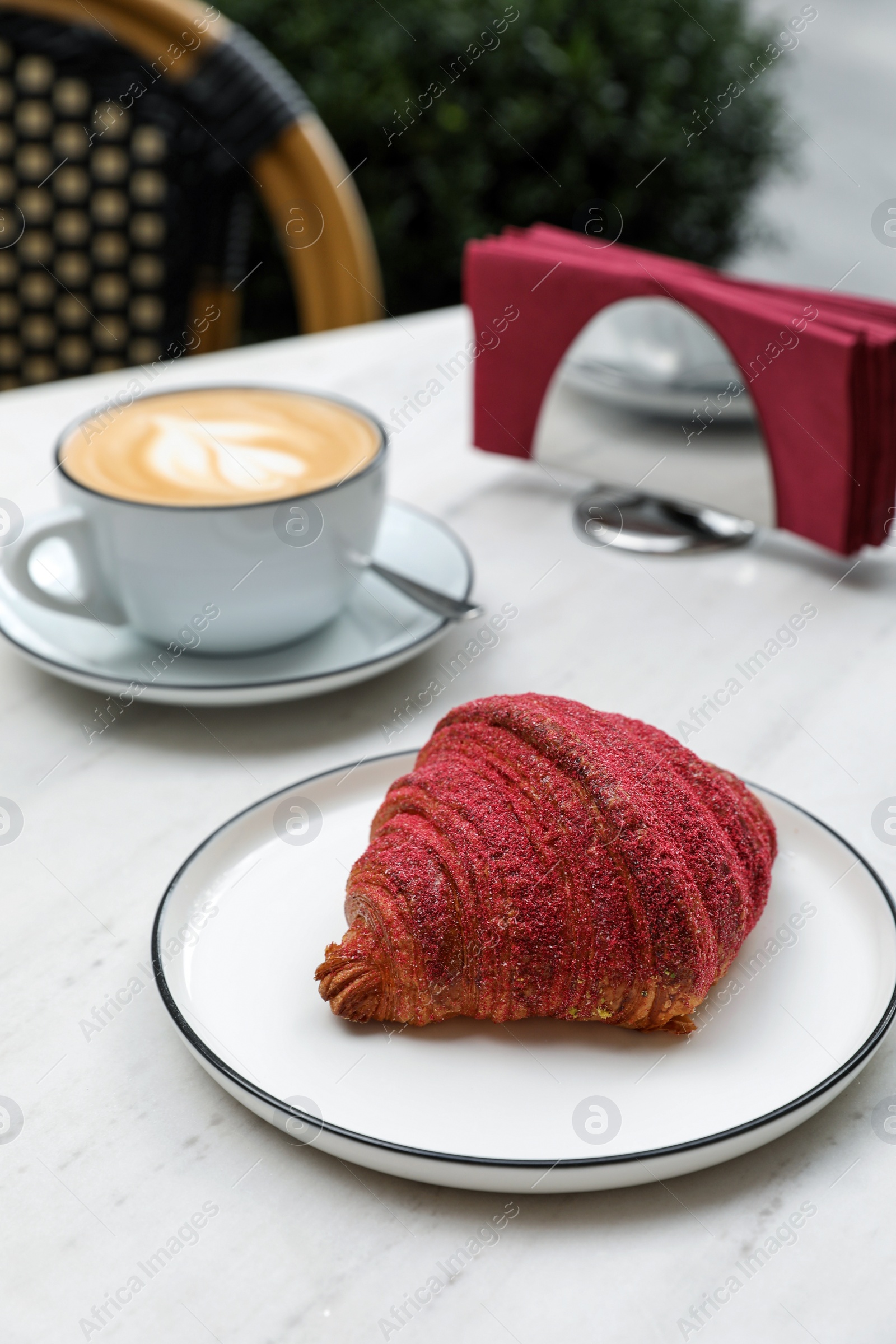 Photo of Delicious croissant and coffee on white marble table