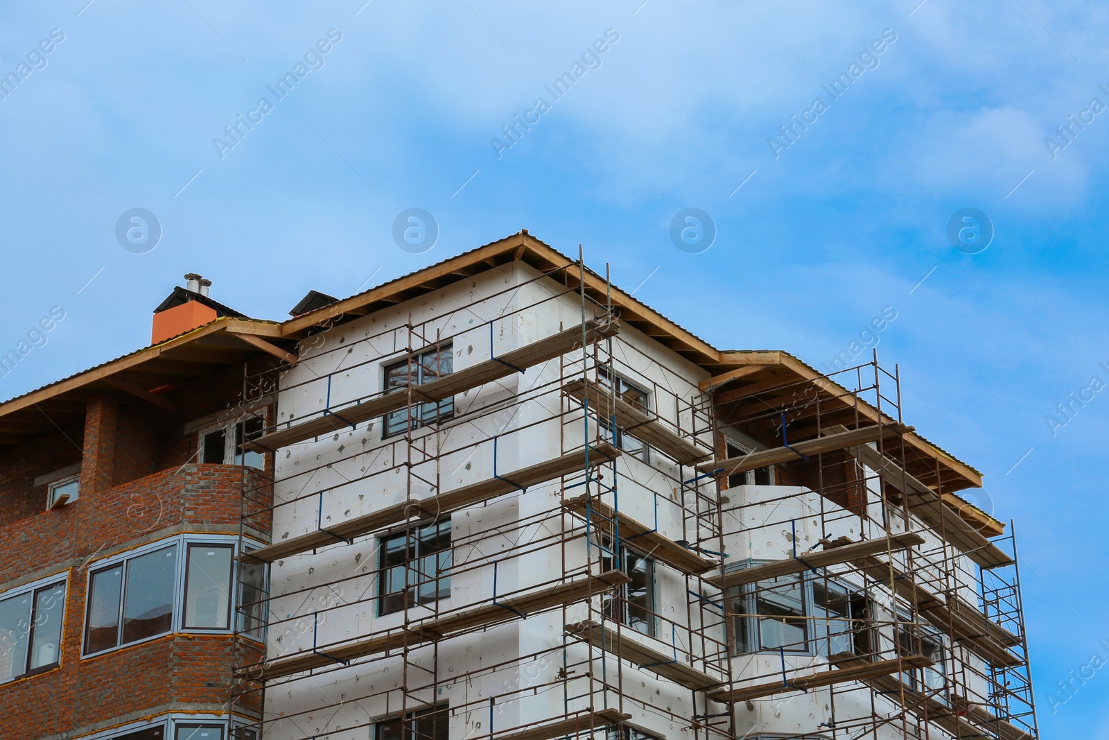 Photo of Construction site with unfinished building against sky, low angle view