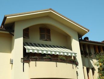 Exterior of residential building with flowers on balcony