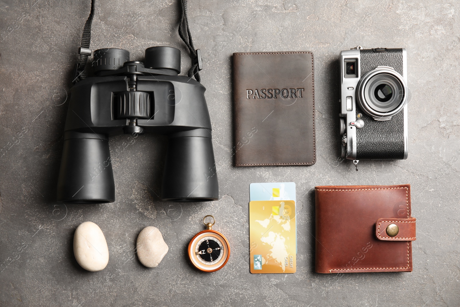 Photo of Flat lay composition with tourist items on grey background. Travel agency