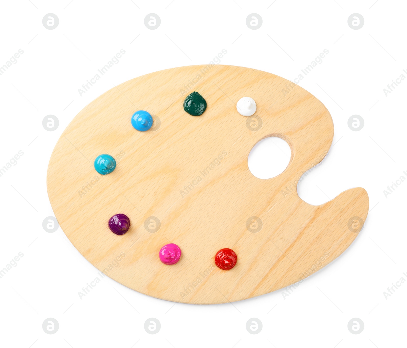 Photo of Wooden artist's palette with samples of paints isolated on white, top view