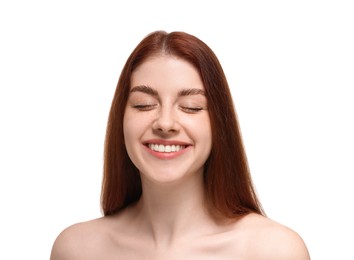 Portrait of smiling woman with freckles on white background