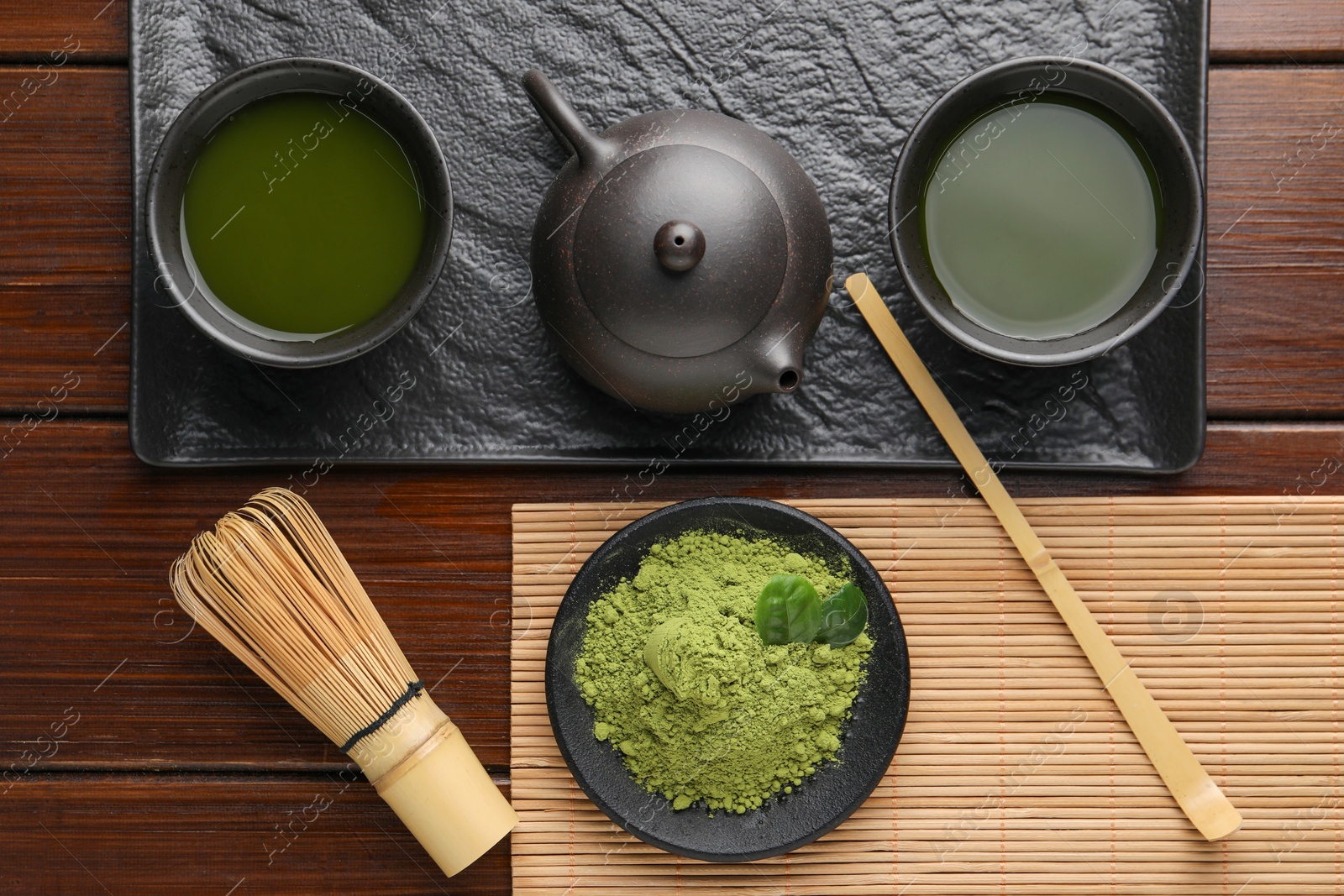 Photo of Flat lay composition with green matcha powder on wooden table