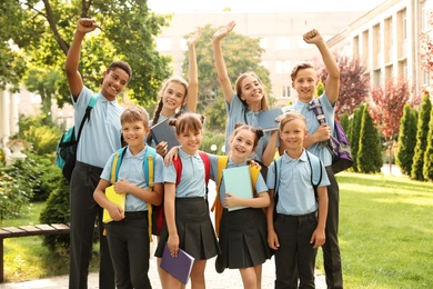 Group of children in stylish school uniform outdoors