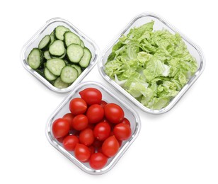 Glass containers with different fresh cut vegetables isolated on white, top view