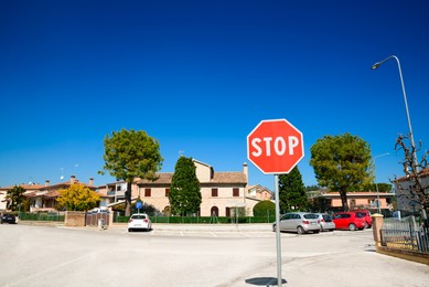 Road sign STOP outdoors on sunny day