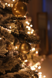 Closeup view of beautifully decorated Christmas tree indoors