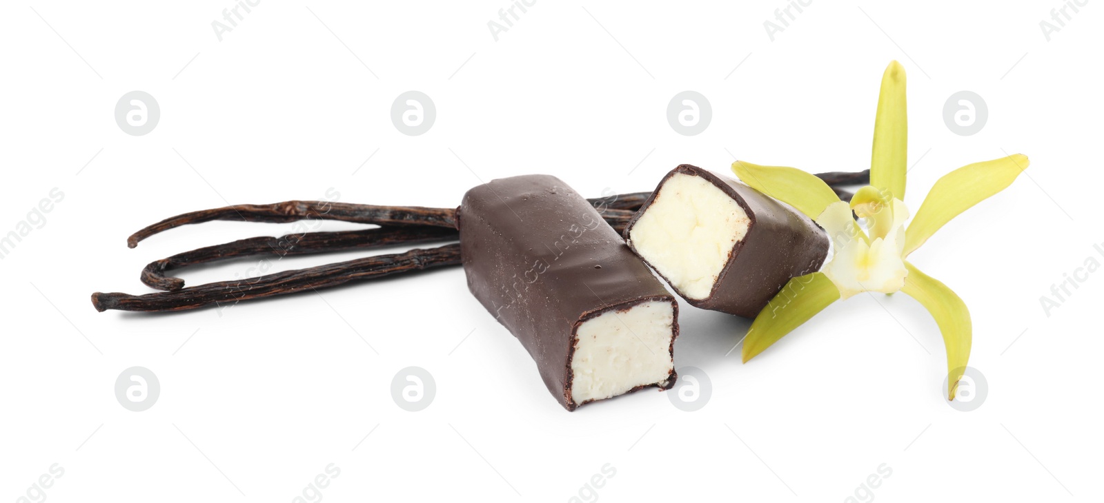 Photo of Glazed curd cheese bars, vanilla pods and flower isolated on white