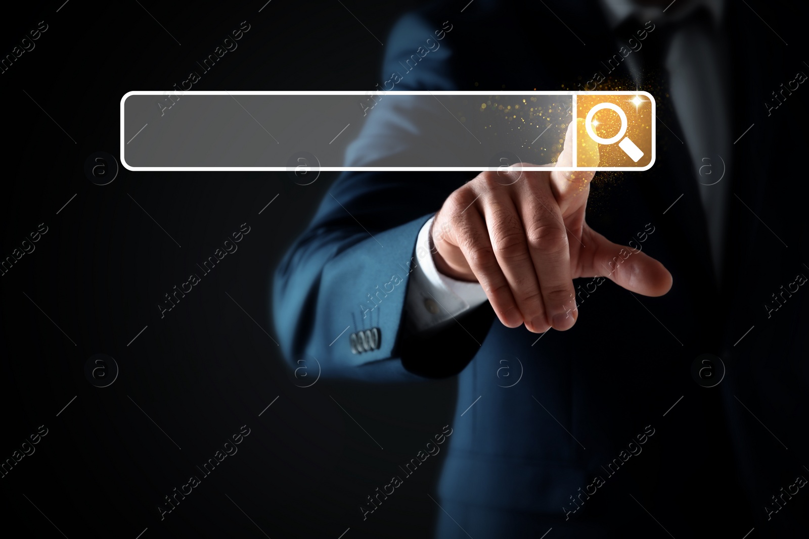 Image of Man pointing at search bar on virtual screen against black background, closeup
