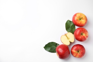 Photo of Fresh ripe red apples and leaves on white background, flat lay. Space for text