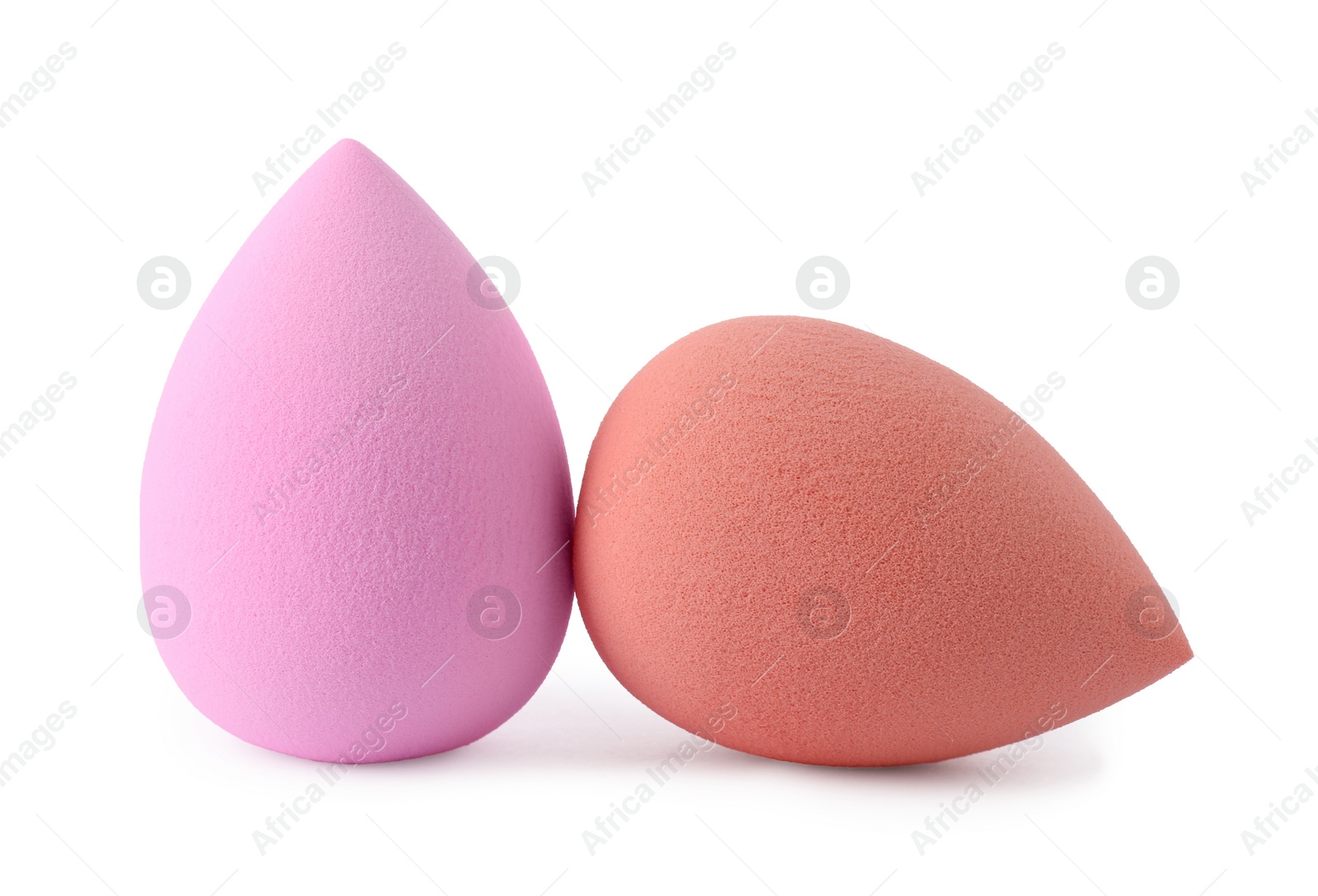 Photo of Two different make up sponges isolated on white