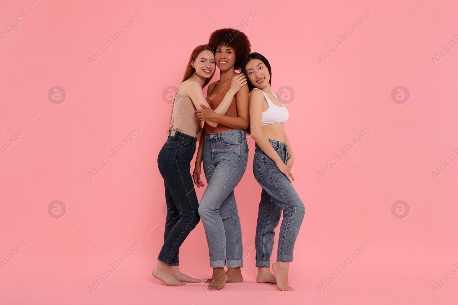 Photo of Portrait of beautiful young women on pink background