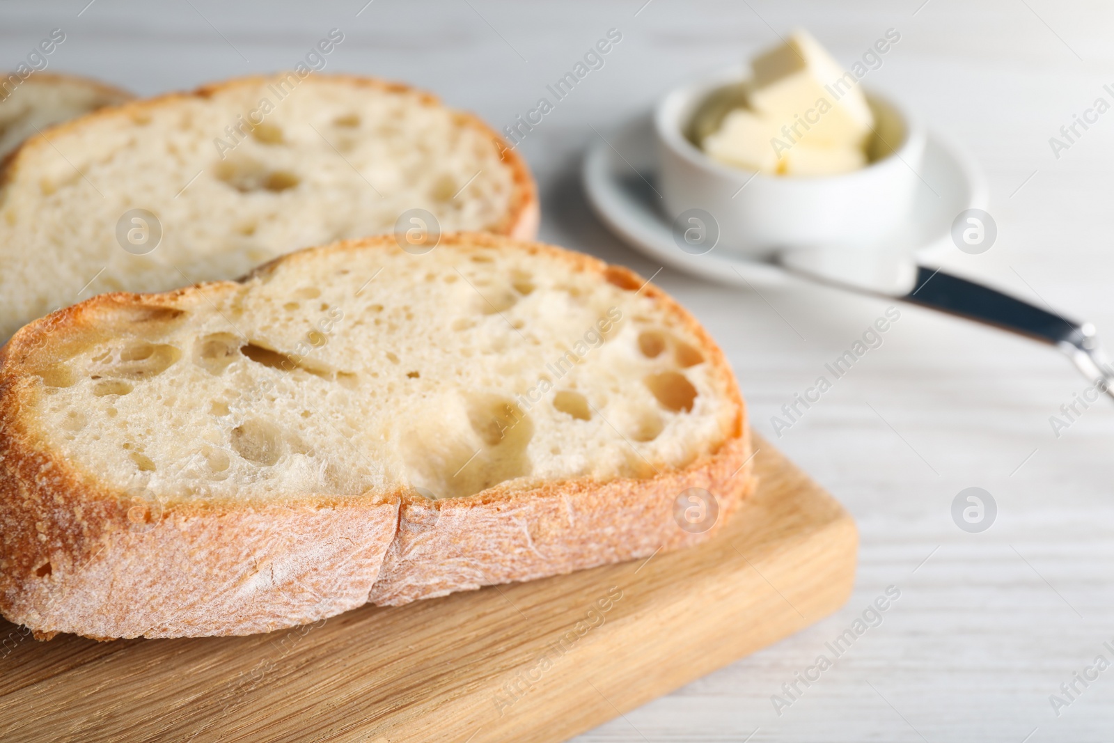 Photo of Freshly baked sodawater bread on white wooden table, closeup