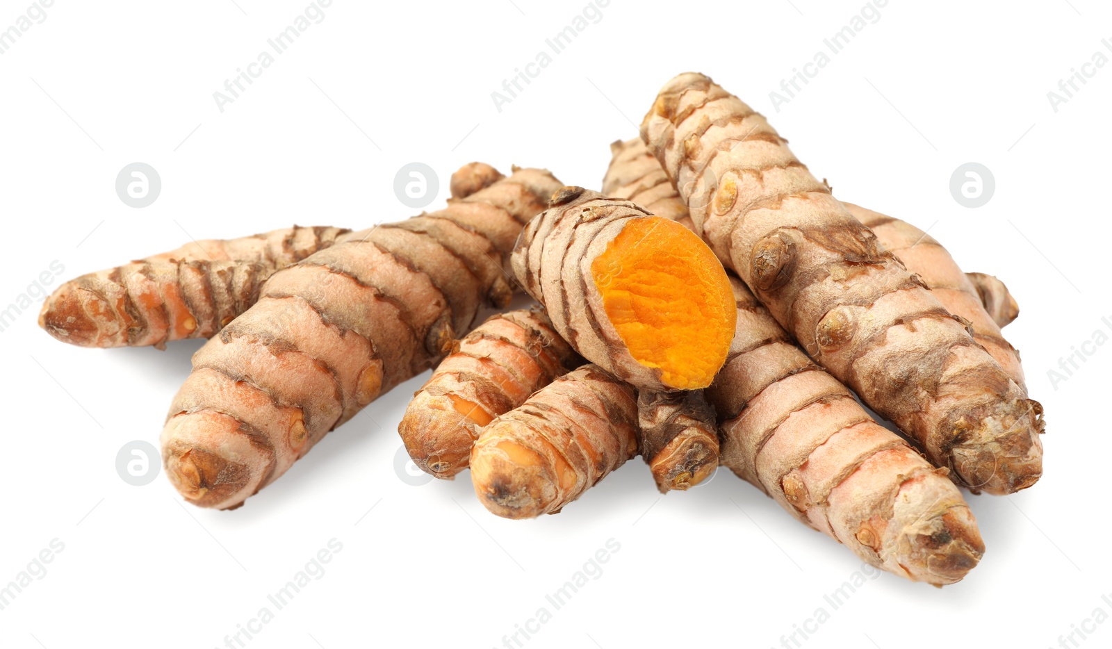 Photo of Whole and cut turmeric roots isolated on white