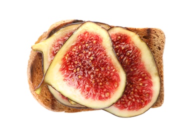 Toasted bread with ripe fig slices on white background, top view