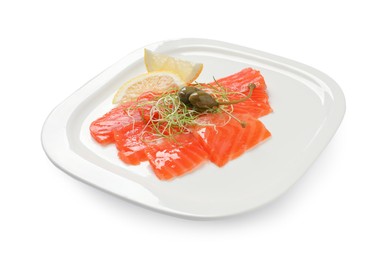 Photo of Salmon carpaccio with capers, microgreens and lemon isolated on white