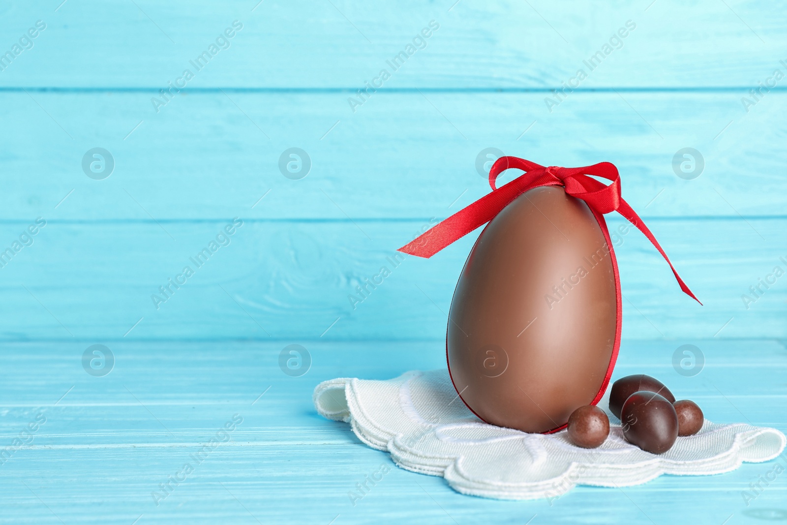 Photo of Composition with chocolate Easter eggs on table. Space for text