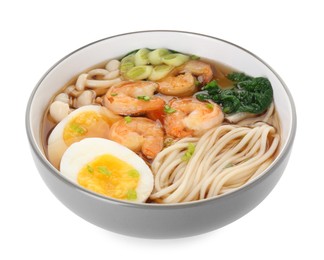 Photo of Delicious ramen with shrimps and egg in bowl isolated on white. Noodle soup