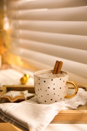 Photo of Composition with cup of hot drink on windowsill