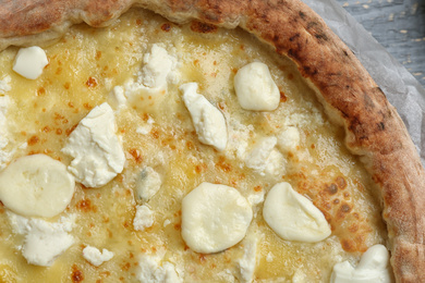 Delicious hot cheese pizza on grey table, top view