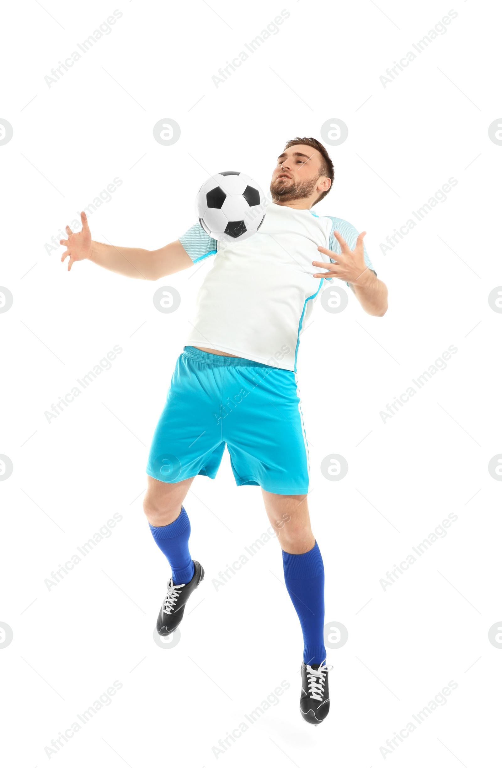 Photo of Young man playing football on white background