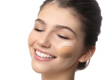 Beautiful girl on white background, closeup. Using concealer and foundation for face contouring