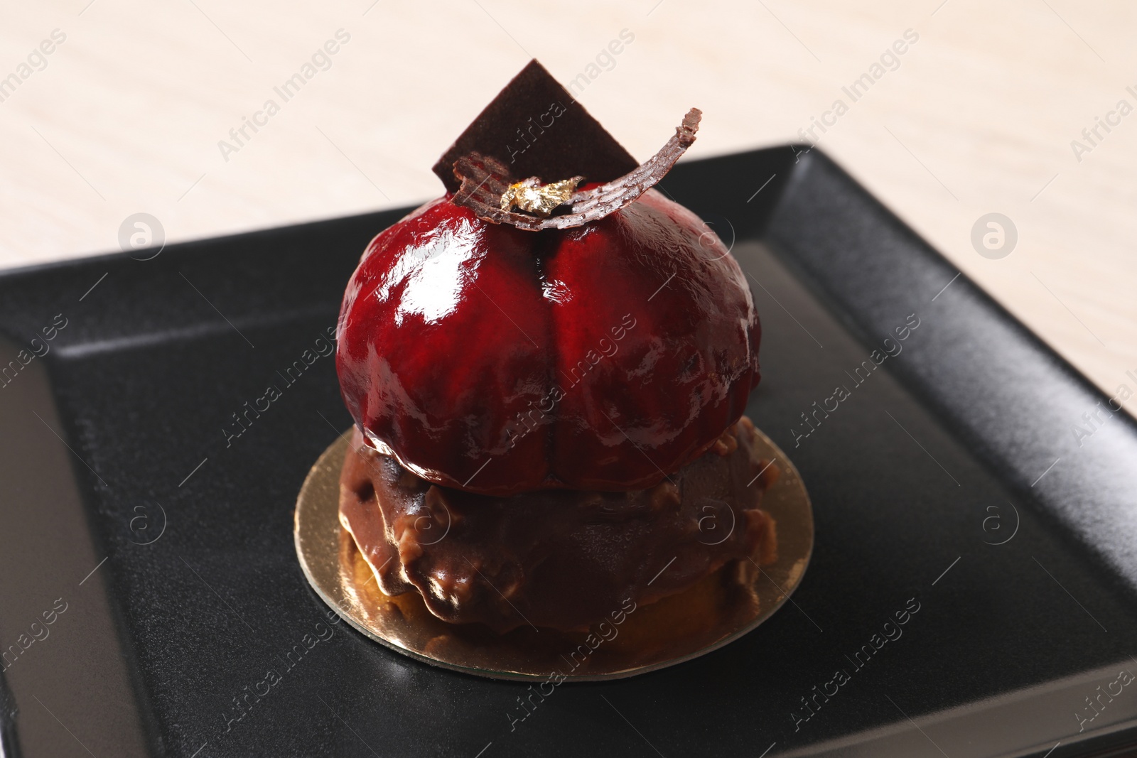 Photo of Delicious nutty dessert with chocolate on plate, closeup