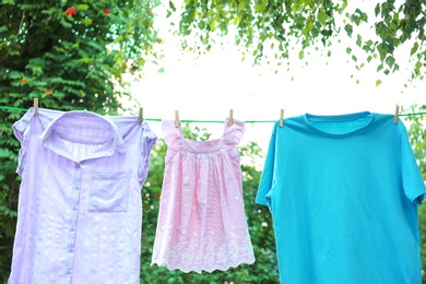 Photo of Clothes on laundry line outdoors on sunny day