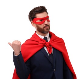 Photo of Confident businessman wearing red superhero cape and mask on white background
