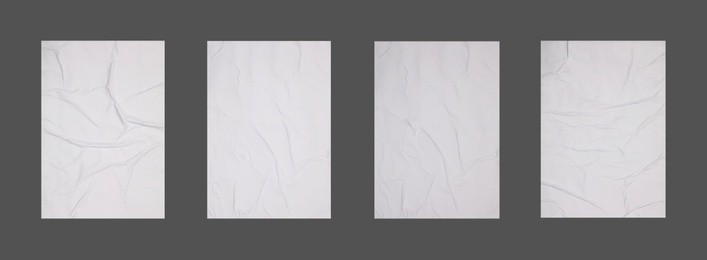 Image of Collection of creased blank posters on grey background. Banner design
